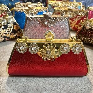 Glamorous Red Clutch with Gold Floral Accents with Crossbody chain strap